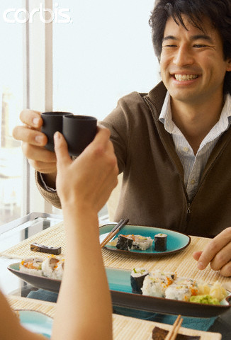 Couple toasting with sake